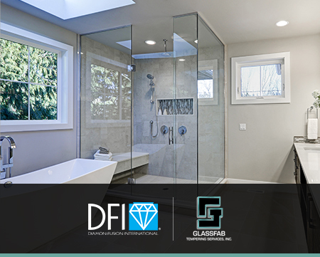 an interior view of a residential bathroom with a frameless shower stall in the corner