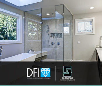 an interior view of a residential bathroom with a frameless shower stall in the corner