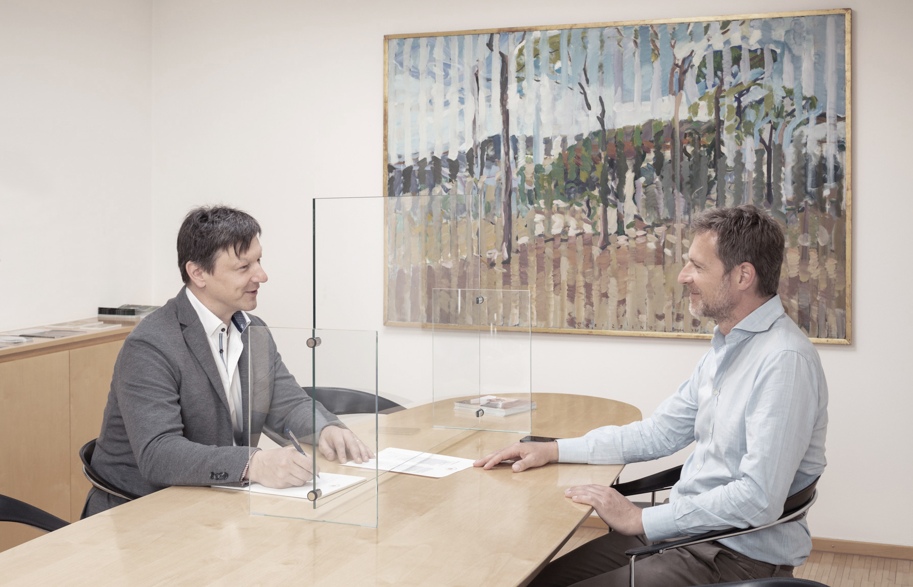 Glass screen at conference table