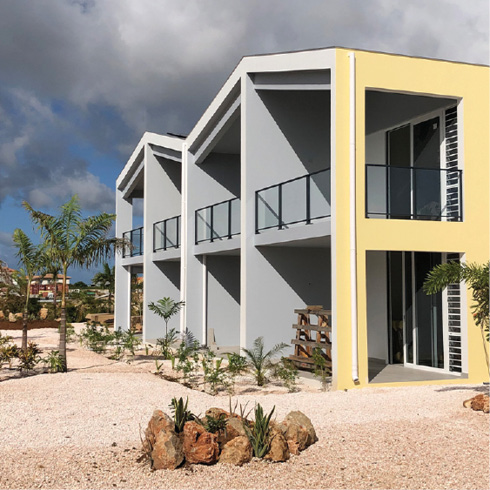 beach apartments with glass railing