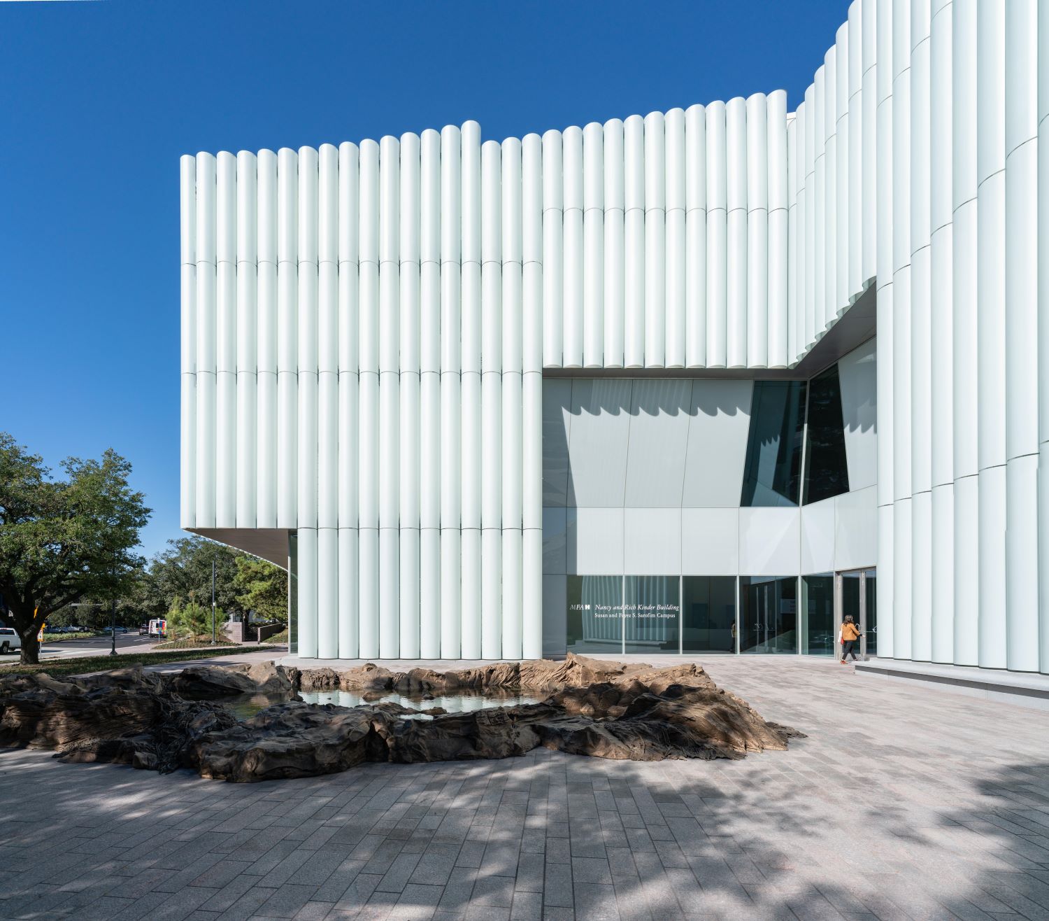 museum facade with laminated, translucent glass tubes