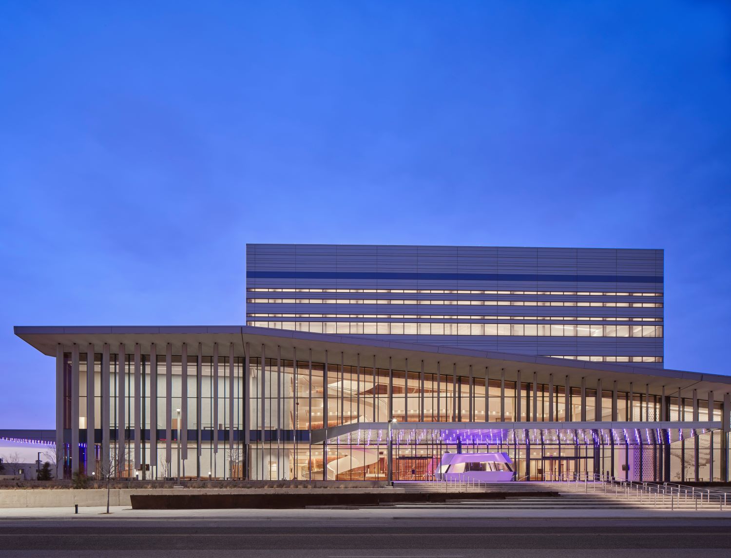 front facing facade of the Buddy Holly Hall of Performing Arts and Sciences showing glass curtainwall