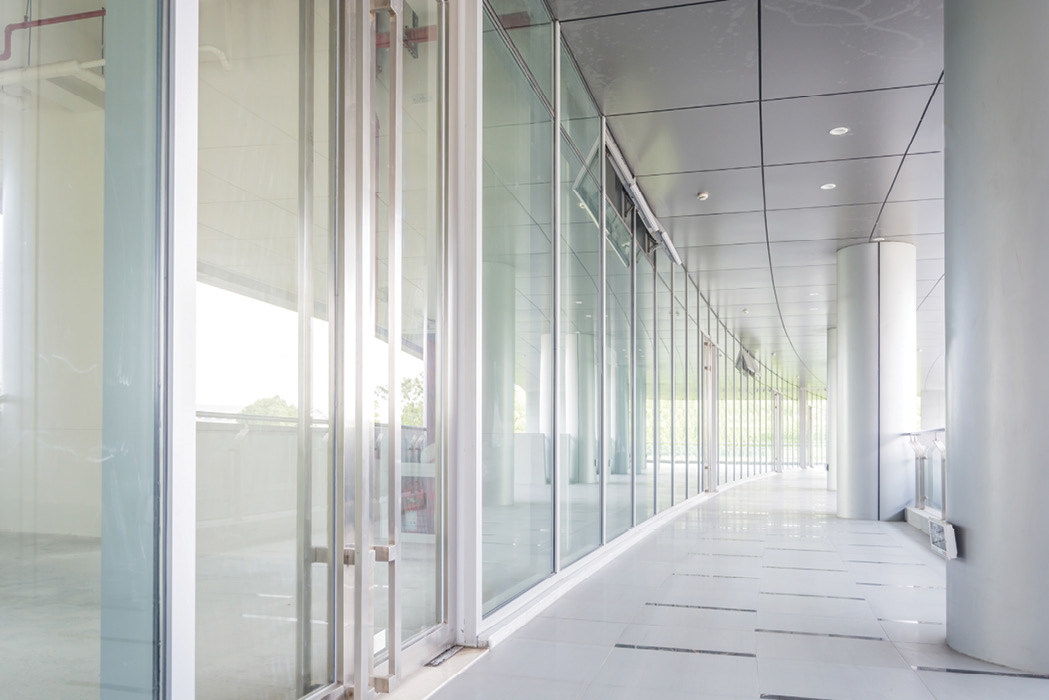 corridor with jumbo glass walls and entrances