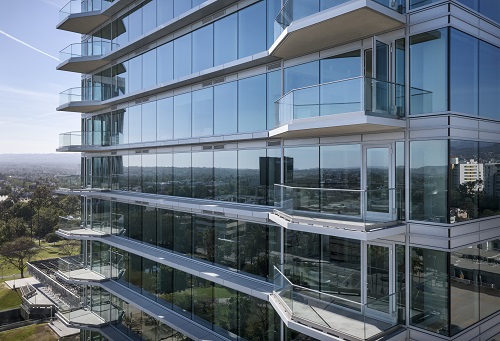Exterior of the Wilshire Curson building featuring glass and metal railings from CRL