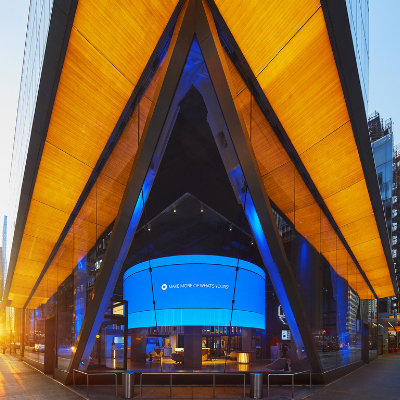 390 Madison Avenue in New York City features a chambered corner that is back-lit wood-grain glass created by GGI Alice direct-to-glass printing