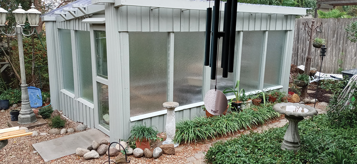 shed built from repurposed shower glass