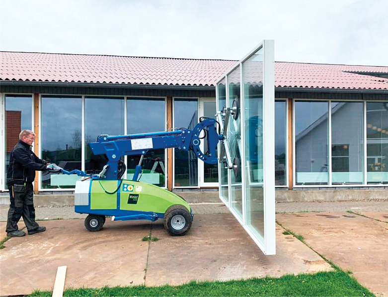 vacuum lifter carries patio door