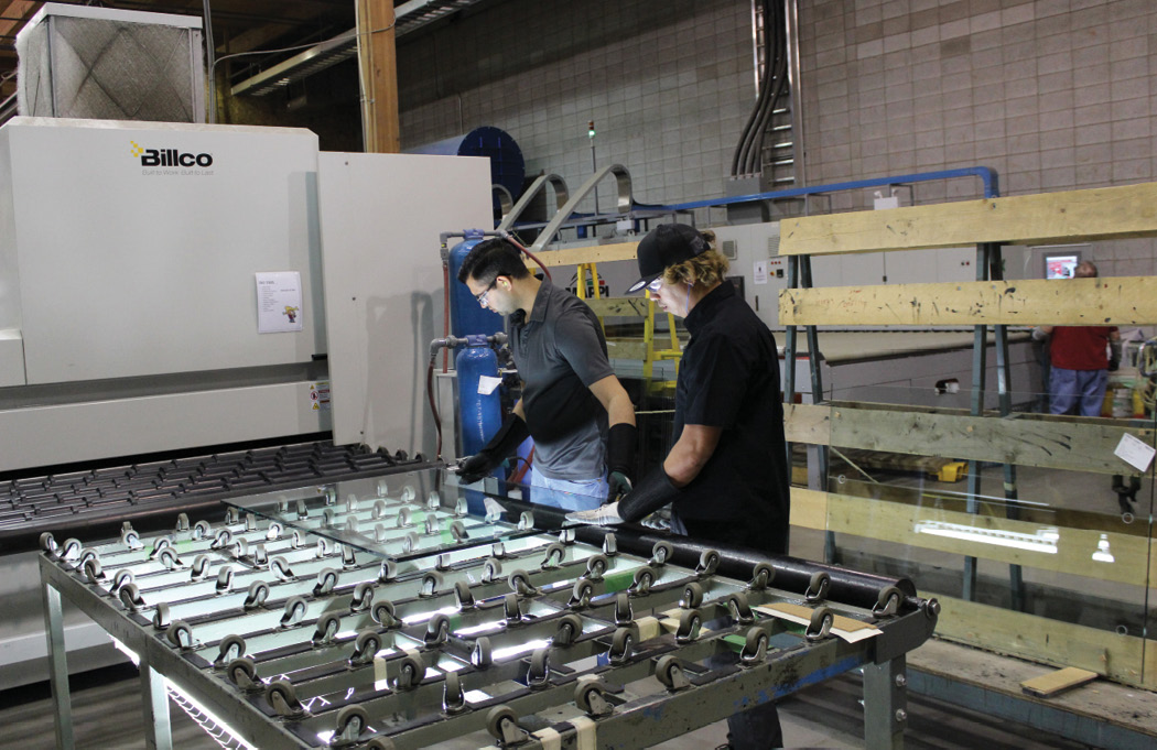 employees inspect glass