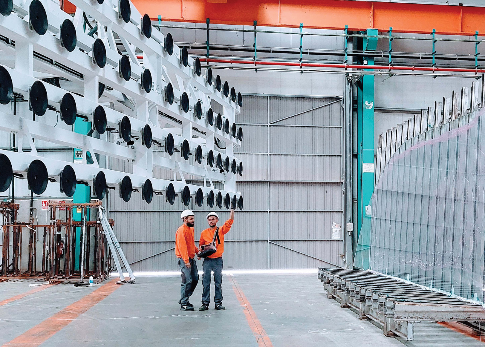 two fabricators on factory floor