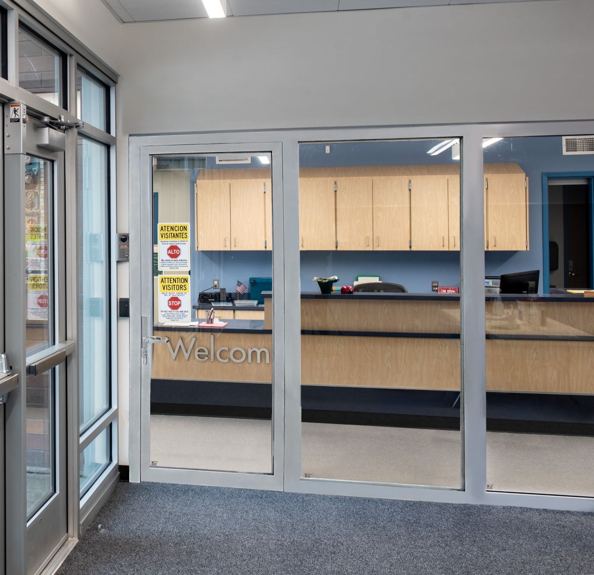 school entrance with fire glass