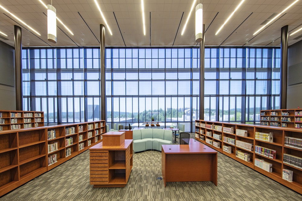 Interior of a high school showing floor to ceiling windows