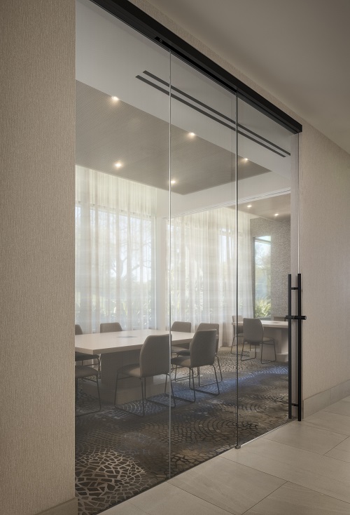 Interior glass and metal sliding doors in the Wilshire Curson building