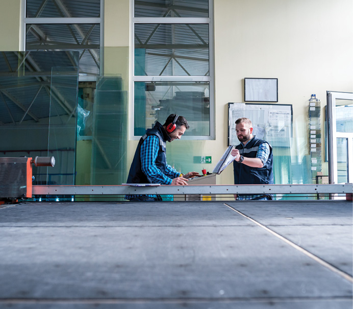 two employees in glazing factory