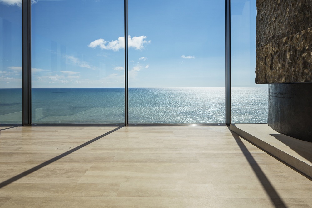 floor to ceiling windows overlooking the ocean