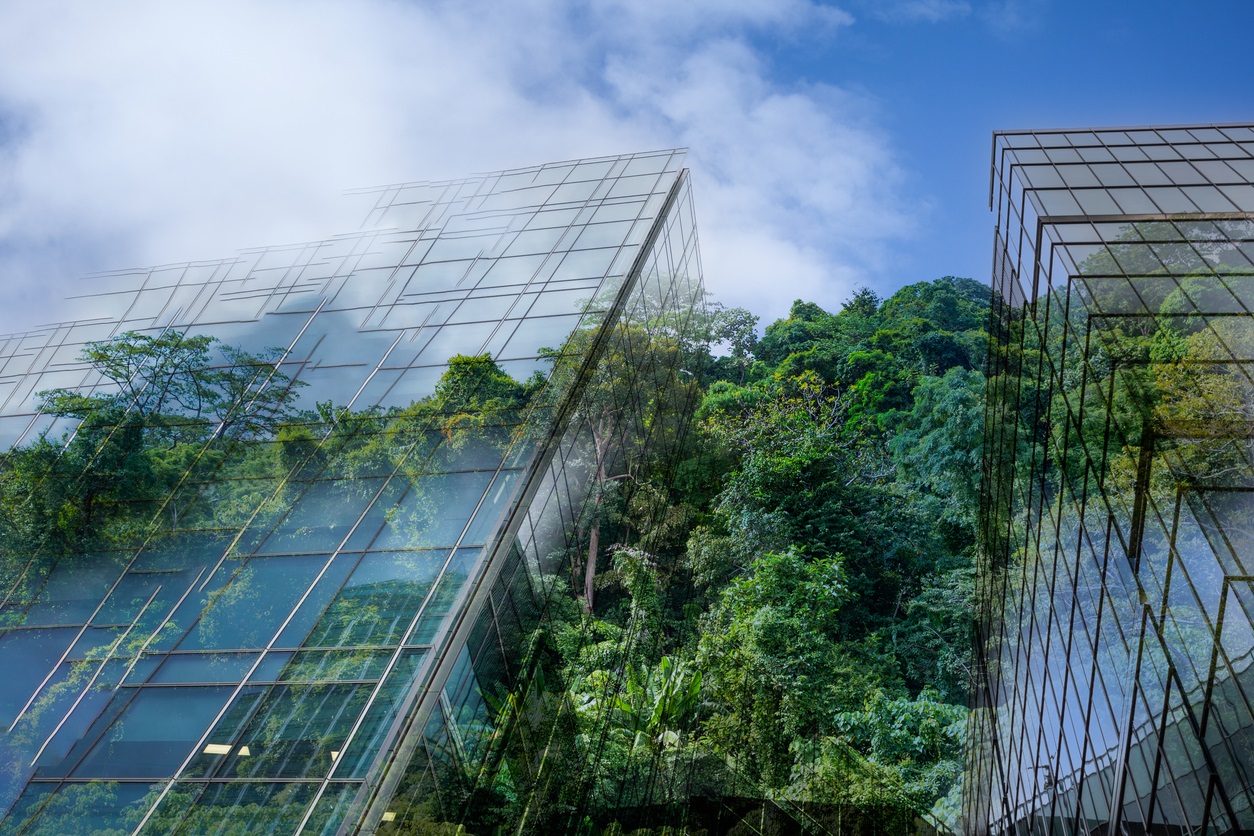 glass buildings among trees