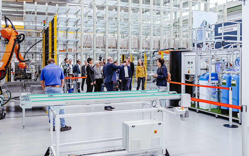 A guided tour at the opening of ENVELON's solar panel production 