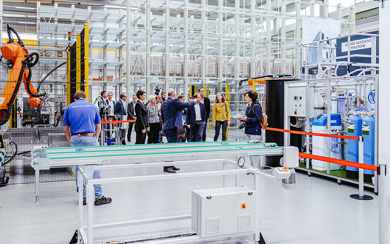 A guided tour at the opening of ENVELON's solar panel production