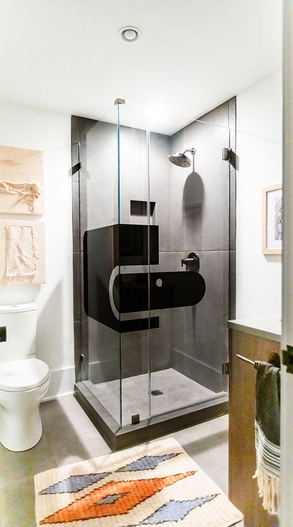 4.	“Ned’s Shower”; designed by Sherry’s son, a graphic designer, the glass features elements of clear glass and digitally-printed modern shapes. 