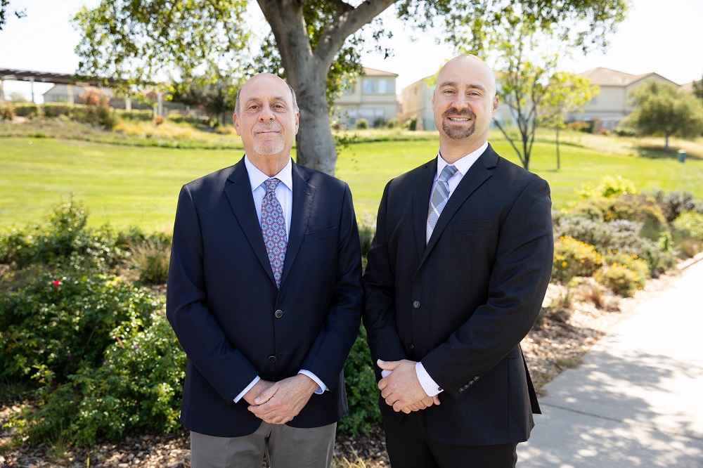 Mike and Aaron Goldfarb, standing together outdoors