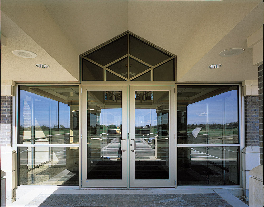 Modified medium stile door entrances with storefront system were selected by Keller, Inc. and installed by Tri-City Glass & Door on at The Bay Family of Companies’ headquarters in Green Bay, Wisconsin.