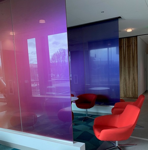 dichroic glass partitions in an office
