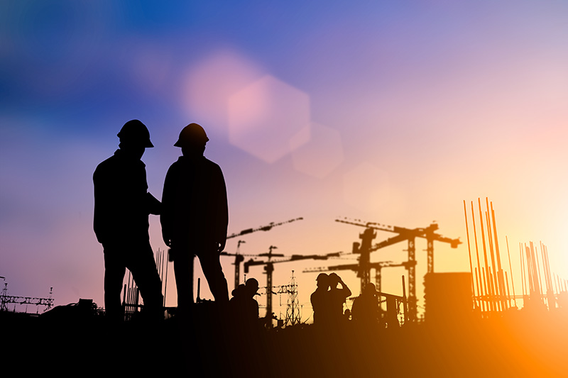 Two construction workers on a jobsite