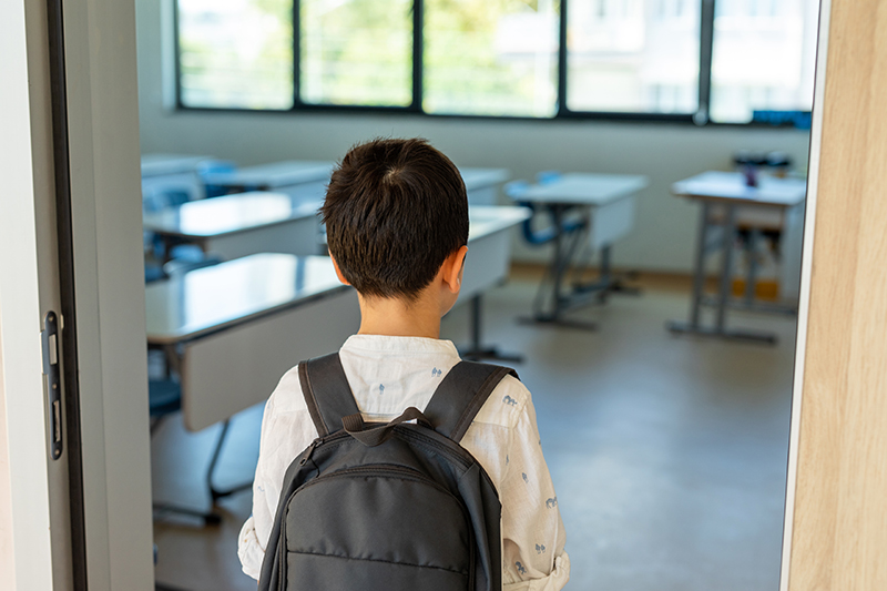 Student entering classroom