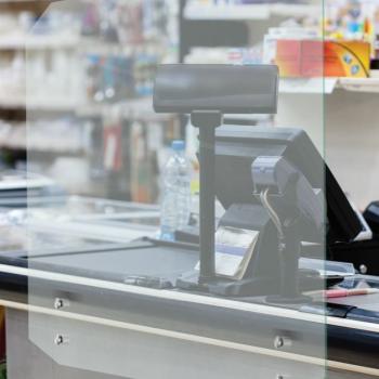 Glass barrier at retail check out