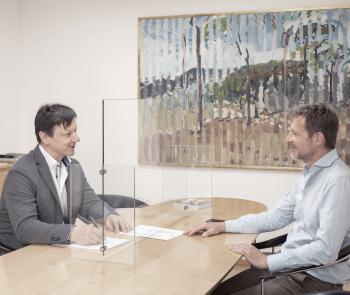 Glass screen at conference table