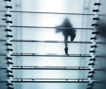 person walking on glass floor