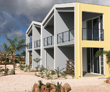 beach apartments with glass railing