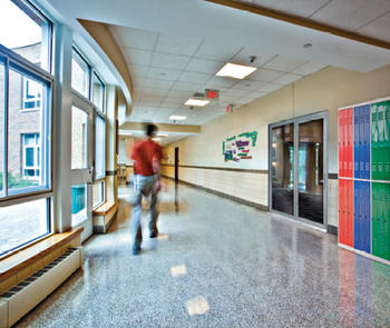 fire-rated glass door system installed in school hallway