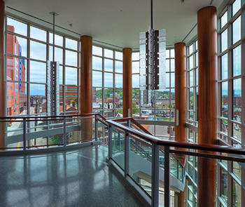 View to outside through glass railings and curtainwall with jumbo glass
