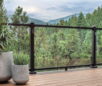 View of mountains through glass deck railing