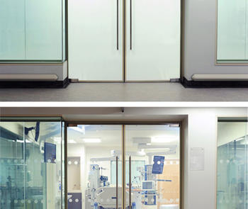 two views of a glass door and side windows in a conference room, the first with opaque glass and the second clear after electricity is turned off