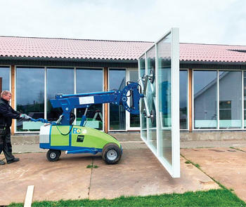 vacuum lifter carries patio door